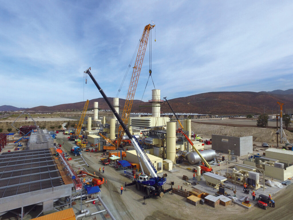 Construction is a coordinated effort between many moving parts, as seen in setting the unit 3 inlet air filter at Pio Pico.