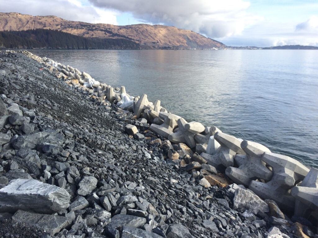 Runway improvements included extending two runways by 600 feet. Armor stone and concrete armor units provide stability along the shoreline.