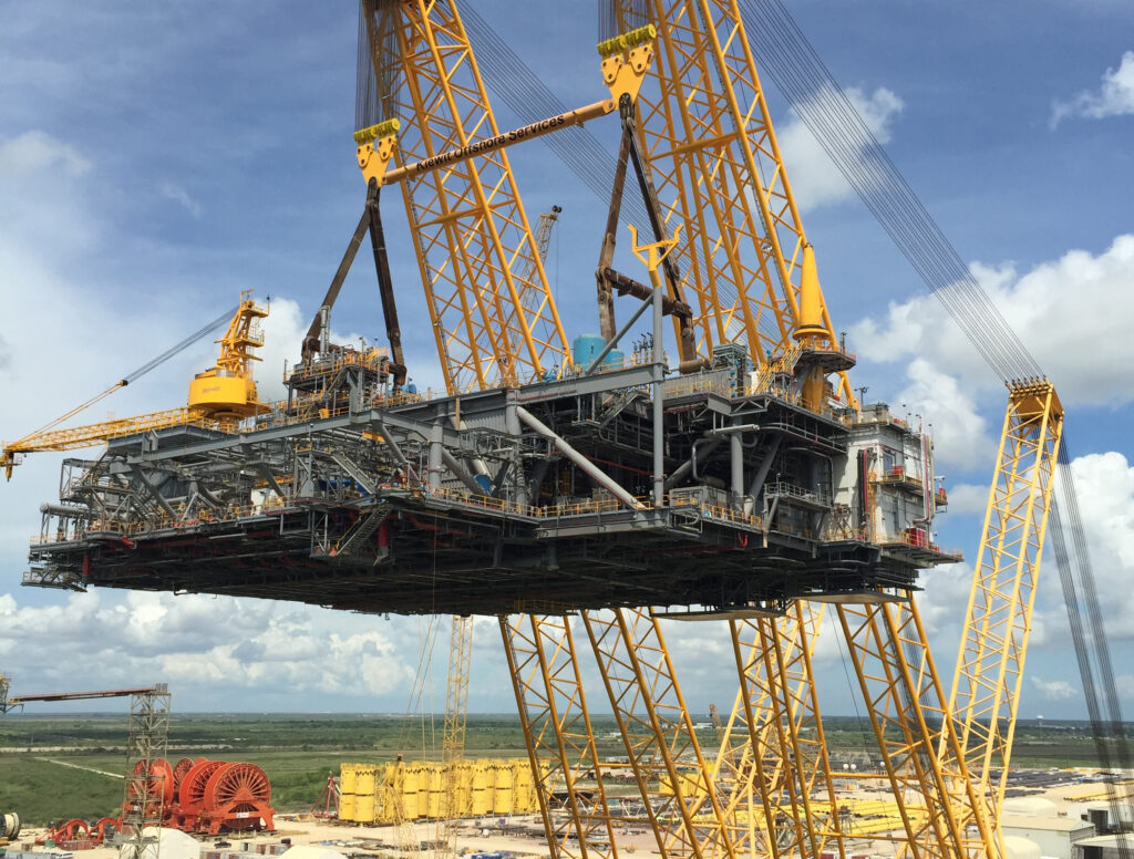 The heavy lifting device (HLD) lifts an offshore topsides platform. The HLD is the only one of its kind and can lift 13,000 tons at a radius of 225 feet.