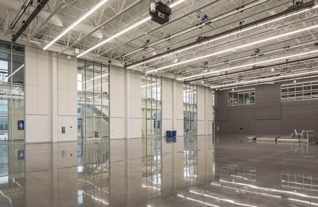 In the Center for Advanced and Emerging Technology (CAET), Innovation Central is a large exhibition space with an aircraft hangar style overhead door.