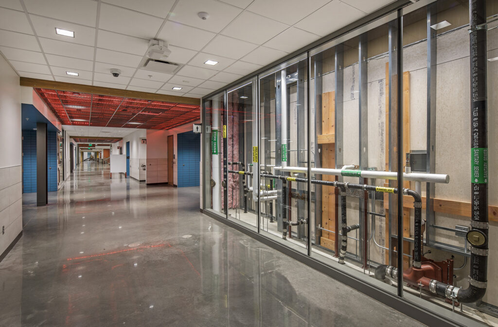 In the new Construction Education Center (CEC) even the building is a teaching tool. Plumbing, utilities, electrical and mechanical systems are all visible through interior glass and lighting.