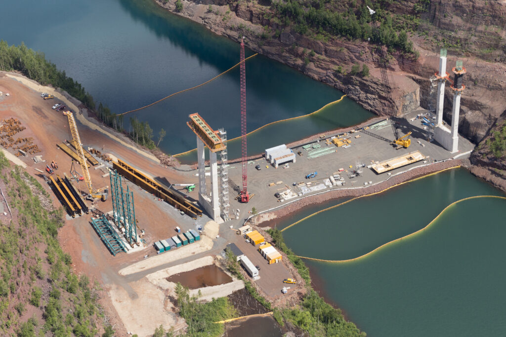 Crews construct a pier cap and column on the causeway.  