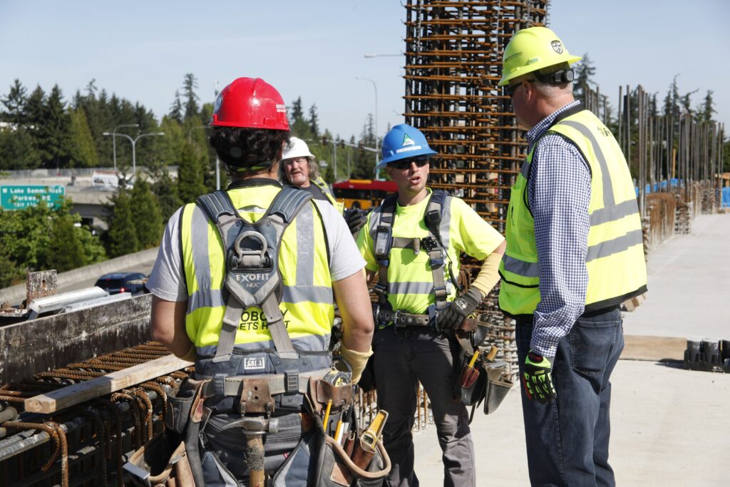 Kiewit Corporation Executive Vice President Doug Glaser speaks with craft workers.