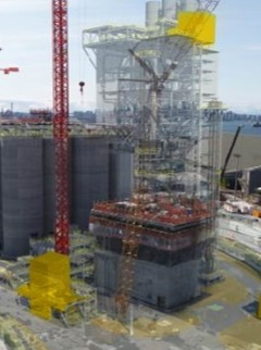 Photograph of a facility being constructed with a 3D model overlayed to indicate design plans