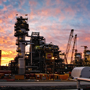 Image of a complex upstream froth treatment facility in the oil sands at sunset