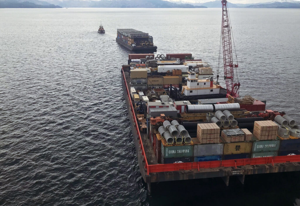 Equipment, materials and supplies travel on barges from the Pacific Northwest. 
