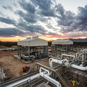 Image of compressor stations at sunset