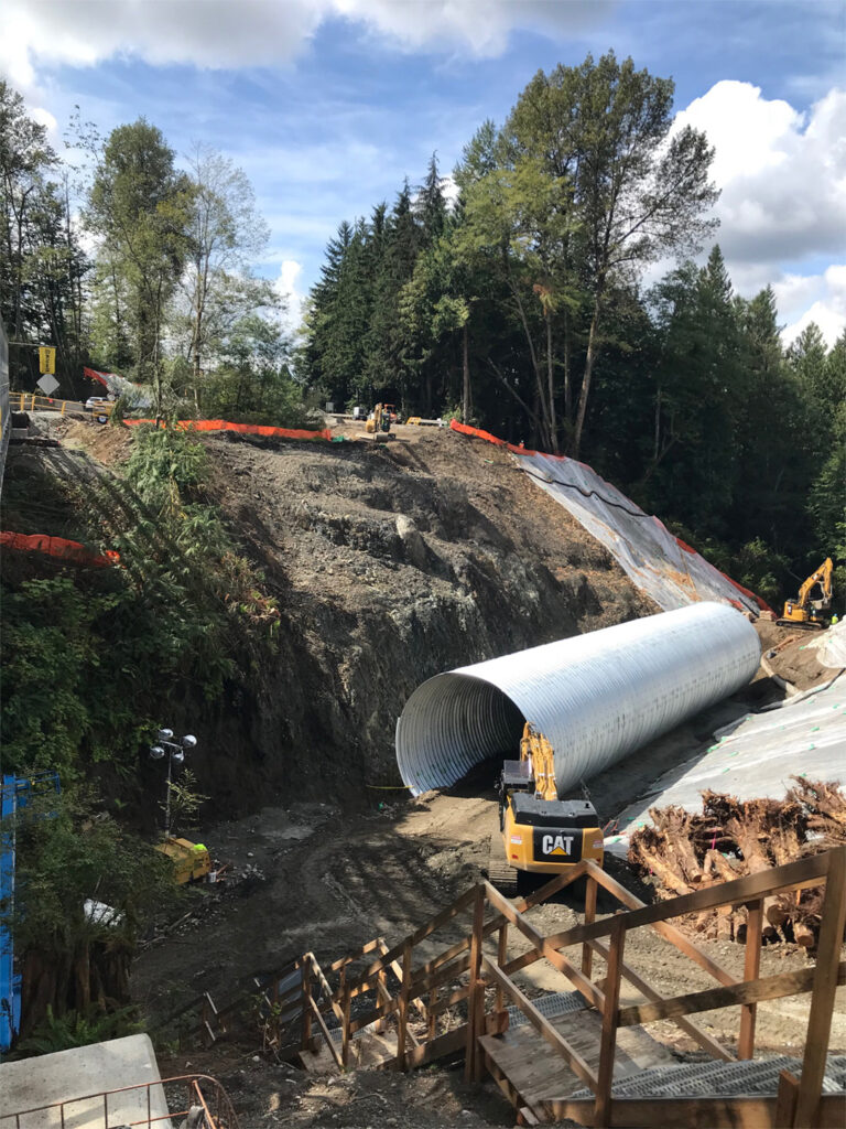 The old concrete culvert was replaced with this  26-foot diameter multi-plate round steel culvert. 