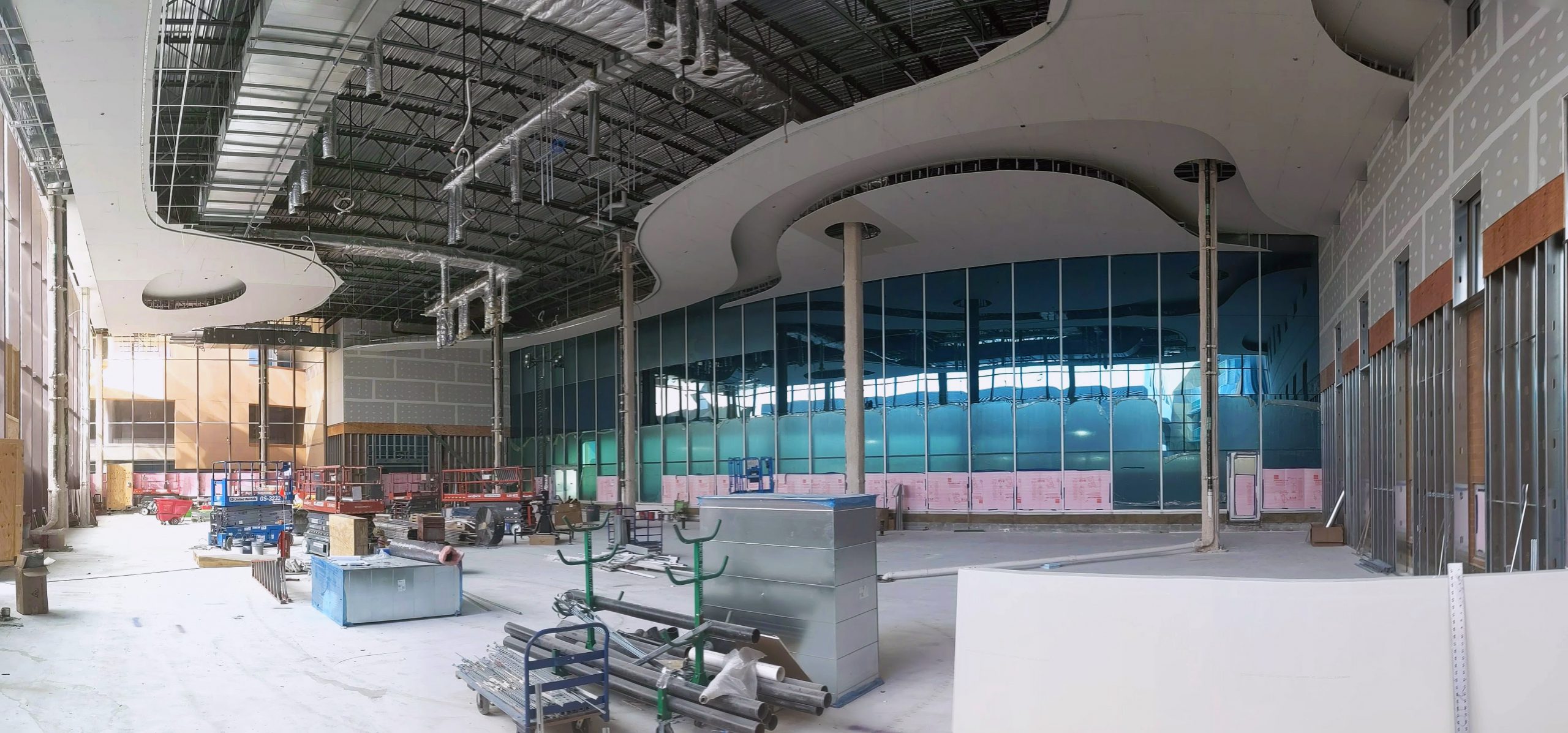 The new 10,000-square-foot solarium features 38-foot-high ceilings and floor-to-ceiling glass walls on two sides that look out onto a new roof garden.