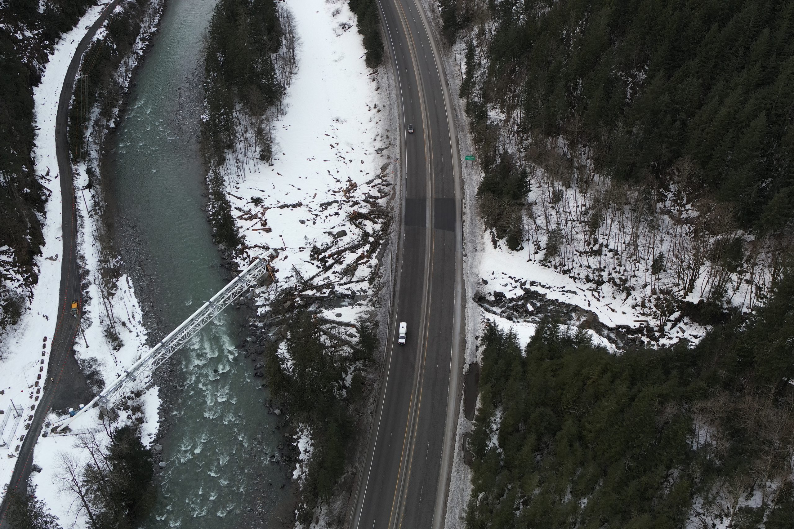This photo shows the highway after crews cleared debris and made road repairs to restore traffic. 