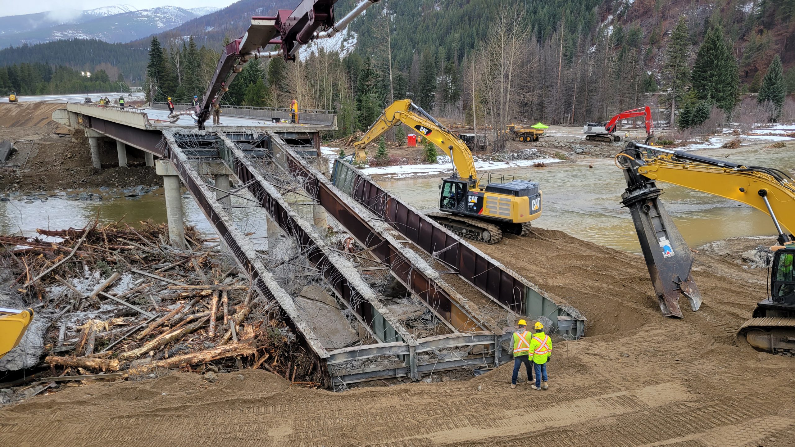 Crews work on demolition of the Bottletop Bridge approach span. The embankment was determined to be salvageable once reinforced. 