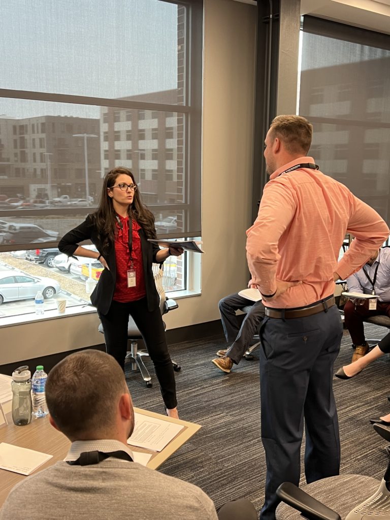 Erin Deck and Anthony Zarn give a demonstration for the Project Management class, discussing how to manage issues such as client and subcontractor specifications, team morale, cost vs. budget and more.