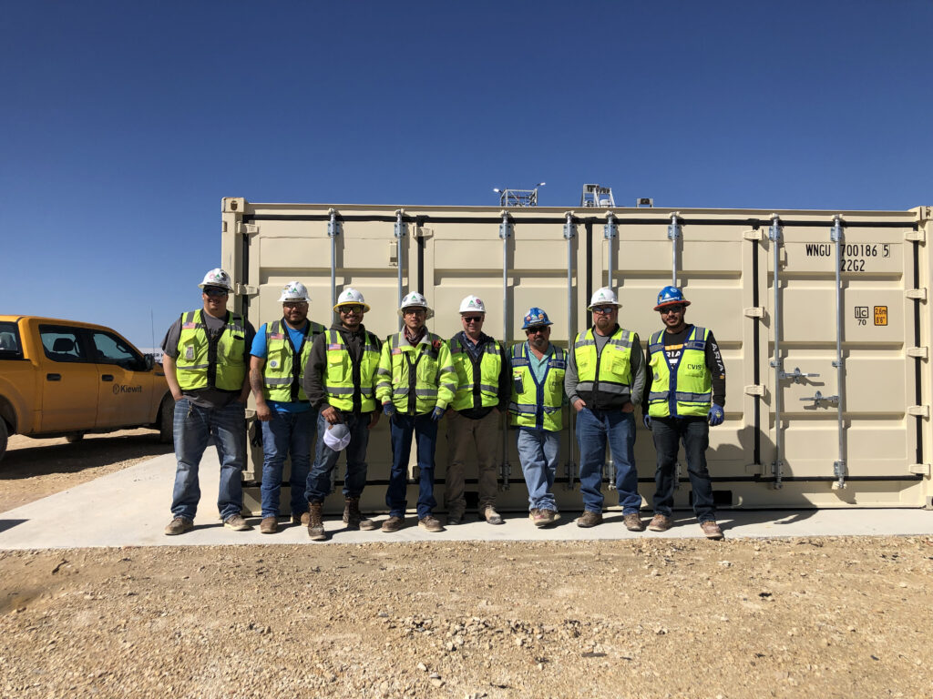 Learners pose in front of a MTF. Feedback collected from learners at the end of training confirms a high level of engagement, especially with hands-on activities.