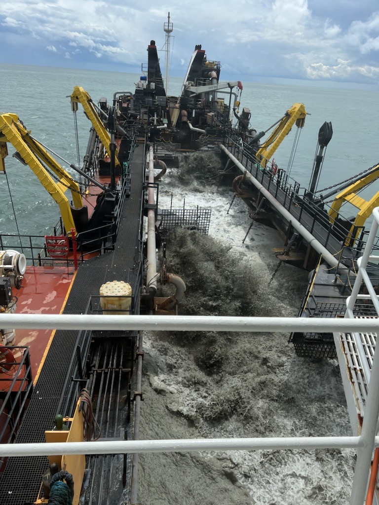 Weeks' crews work to restore a beach off the Delaware Coast.
