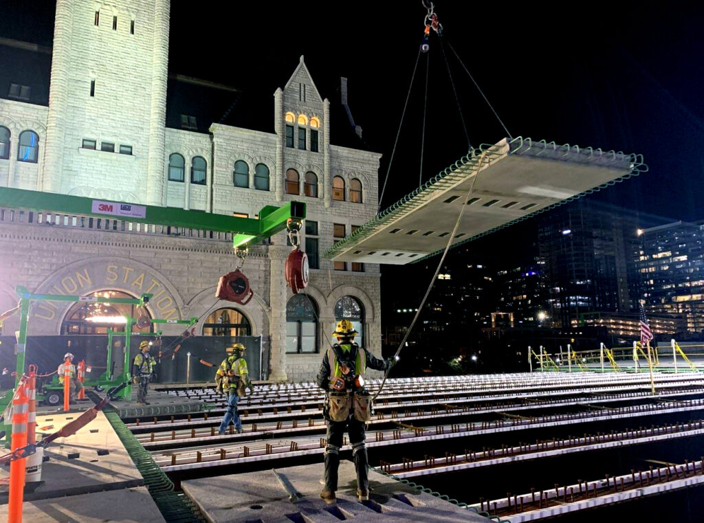 Kiewit used precast concrete panels for the deck as part of the accelerated bridge construction process. The bridge was raised about two feet over the railroad to meet new construction standards. 