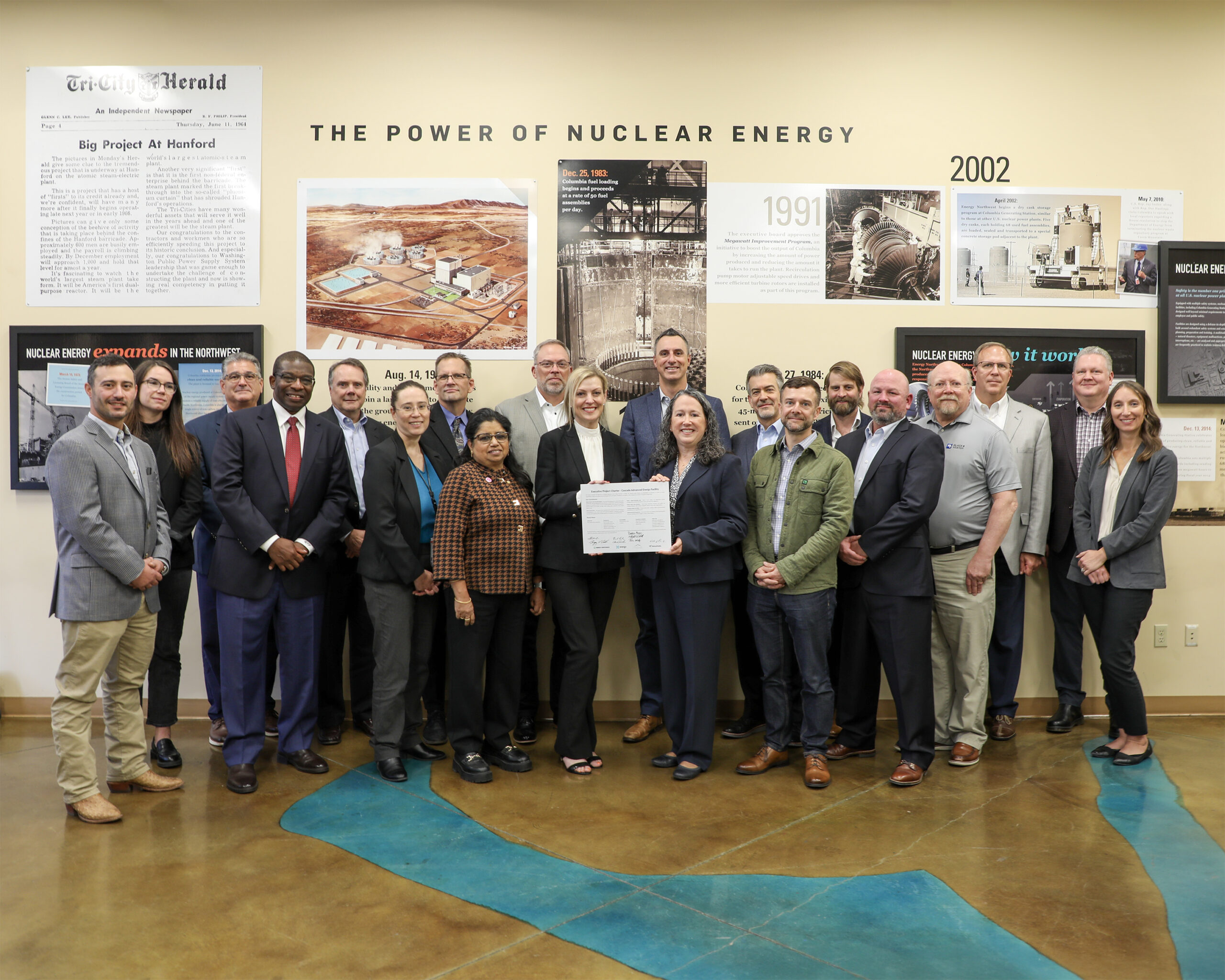 Representatives from Energy Northwest, X-energy, Cascade Nuclear Partners, Amazon and AtkinsRéalis sign a charter in Richland, Washington, affirming their joint commitment to delivering the Cascade Advanced Energy Facility.