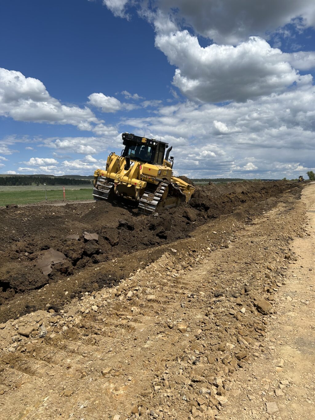 Crews perform earthwork along the corridor as part of bridge replacements and roadway improvements across the project.