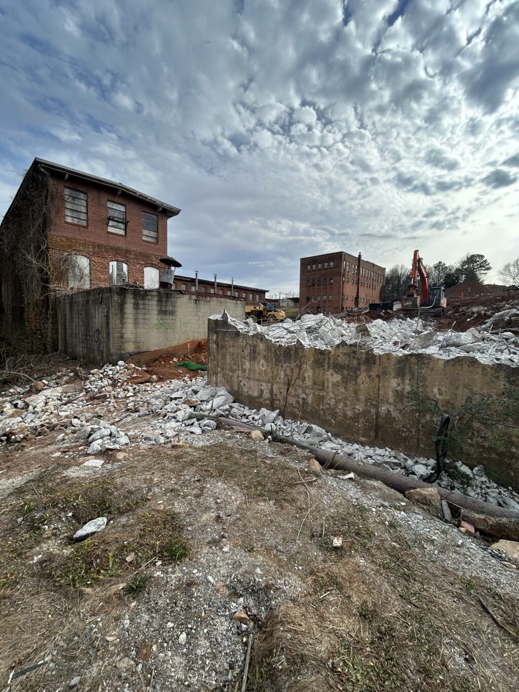 The original Lake Conestee Dam, built in the 1890s, remained in service far beyond its intended lifespan, leaving the historic Conestee Mill vulnerable to flooding during larger storm events.